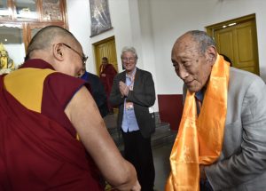 His Holiness theDalai Lama with Lama and Richard Gere i the background