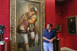 Philippe Cros in front of Le Fauconnier by Veronese