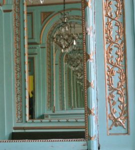 IN the XVIII th century salon, mirrors play with wood decoration