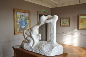 Three Van Gogh and a Monet surround Rodin's sculpture